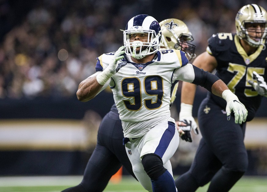 Los Angeles Rams defensive end Aaron Donald (99) rushes New Orleans Saints quarterback Drew Brees (9) in the first half of the NFC Championship at the Mercedes-Benz Superdome in New Orleans on January ...