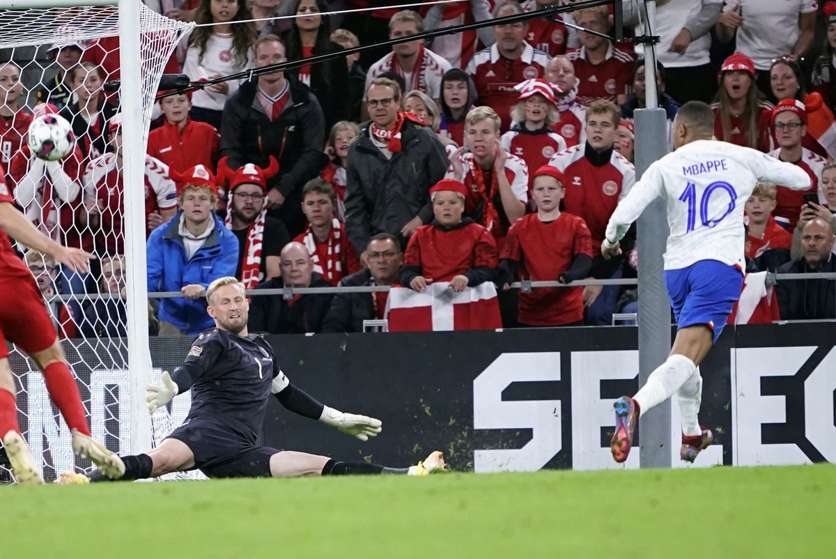 Denmark&#039;s goalkeeper Kasper Schmeichel makes a save on France&#039;s Kylian Mbappé, right, during the UEFA Nations League soccer match between Denmark and France at Parken Stadium in Copenhagen,  ...