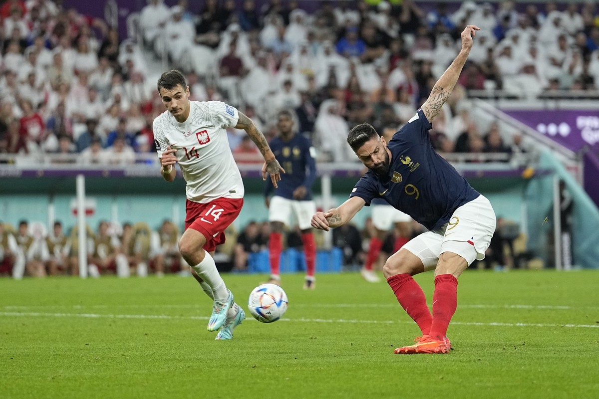 France&#039;s Olivier Giroud scores the opening goal during the World Cup round of 16 soccer match between France and Poland, at the Al Thumama Stadium in Doha, Qatar, Sunday, Dec. 4, 2022. (AP Photo/ ...