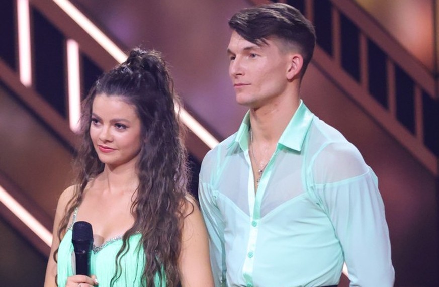 COLOGNE, GERMANY - MARCH 01: Host Daniel Hartwich, Maria Clara Groppler and Mikael Tatarkin talk to the jury after their performance during the first &quot;Let&#039;s Dance&quot; show at MMC Studios o ...