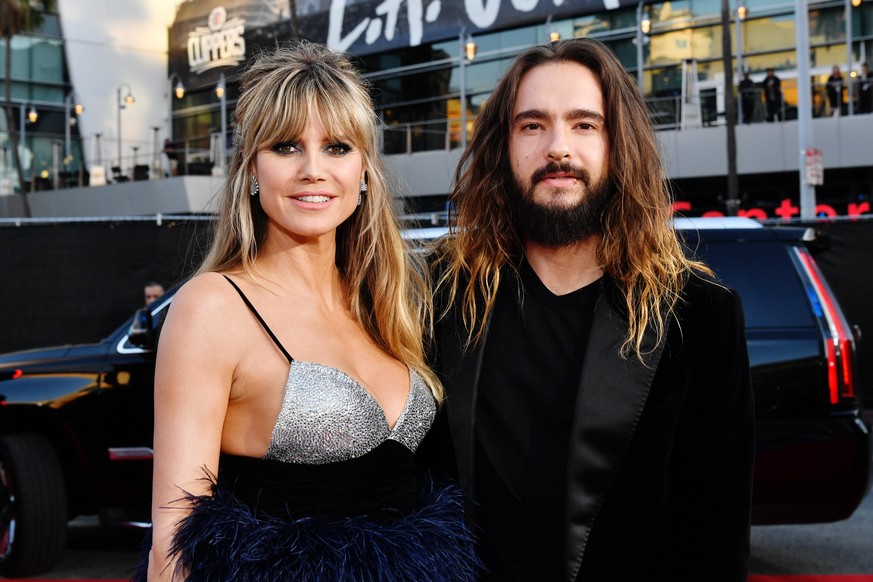 LOS ANGELES, CALIFORNIA - NOVEMBER 24: (L-R) Heidi Klum and Tom Kaulitz attend the 2019 American Music Awards at Microsoft Theater on November 24, 2019 in Los Angeles, California. (Photo by Emma McInt ...