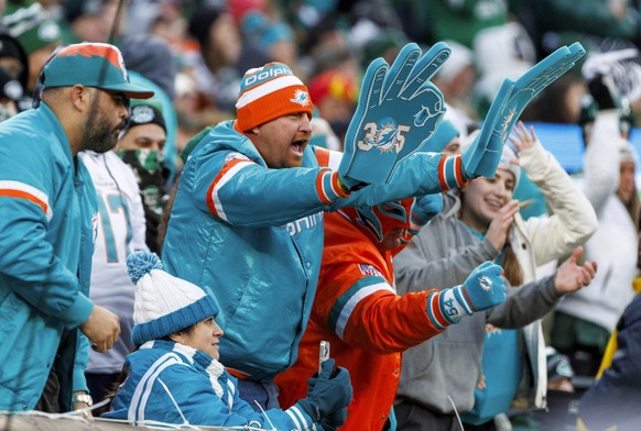 Miami Dolphins fans cheer during the second quarter of the team&#039;s NFL football game against the New York Jets on Friday, Nov. 24, 2023, in East Rutherford, N.J. (David Santiago/Miami Herald via A ...