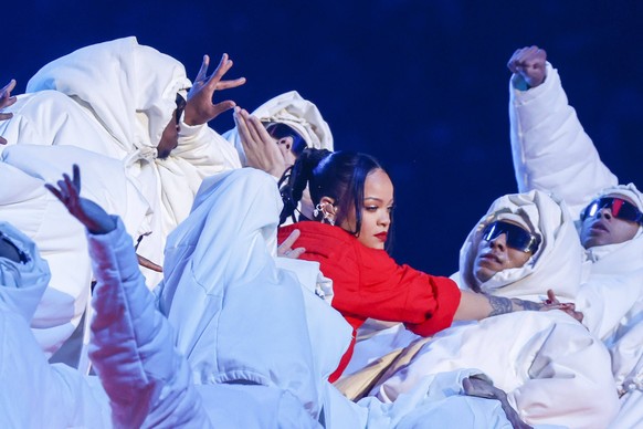 Grammy award-winning R&amp;B, pop, hip-hop, reggae, and EDM singer Rihanna performs during the Super Bowl LVII halftime show during the first half of Super Bowl LVII at State Farm Stadium in Glendale, ...