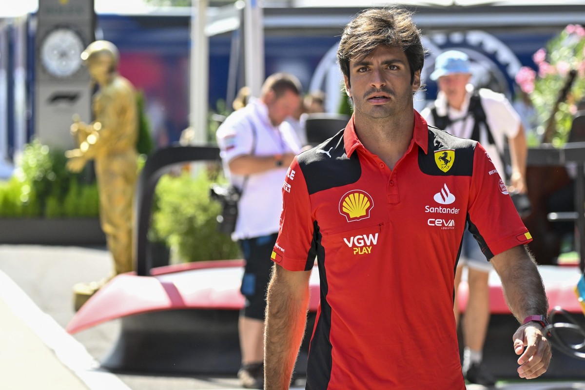 Spanish Formula One driver Carlos Sainz of Scuderia Ferrari walks through the paddock prior the Formula One Hungarian Grand Prix auto race, at the Hungaroring racetrack in Mogyorod, near Budapest, Hun ...