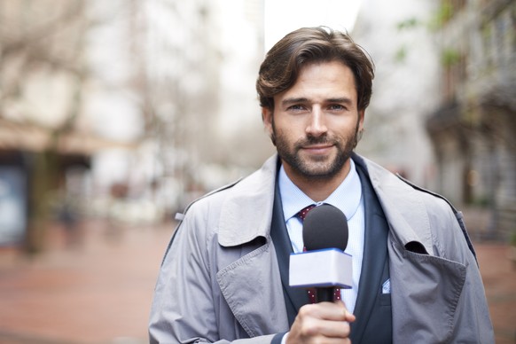 Shot of a reporter ready to conduct an interview on the street