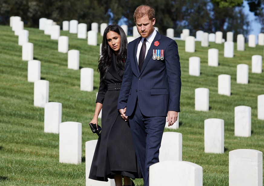 Britain's Prince Harry and Meghan, Duchess of Sussex visit the Los Angeles National Cemetery in honour of Remembrance Sunday, in Los Angeles, California, U.S., November 8, 2020. LEE MORGAN/Handout via ...
