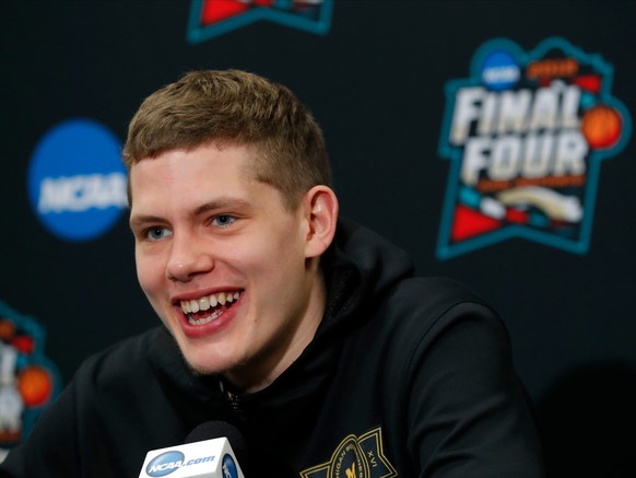 Michigan's Moritz Wagner answers questions during a news conference for the championship game of the Final Four NCAA college basketball tournament, Sunday, April 1, 2018, in San Antonio. (AP Photo/Cha ...
