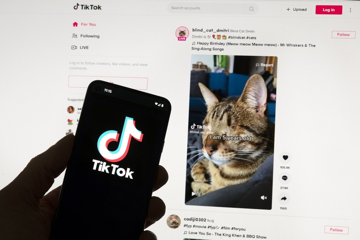 FILE - The TikTok logo is seen on a mobile phone in front of a computer screen which displays the TikTok home screen, on March 18, 2023, in Boston. TikTok owner ByteDance can&#039;t avoid the bloc&#03 ...