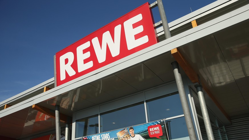 BERLIN, GERMANY - MAY 10: A Rewe supermarket branch stands on May 10, 2016 in Berlin, Germany. German anti-cartel authorities announced yesterday they are charging Rewe as well as chains Metro, Edeka  ...