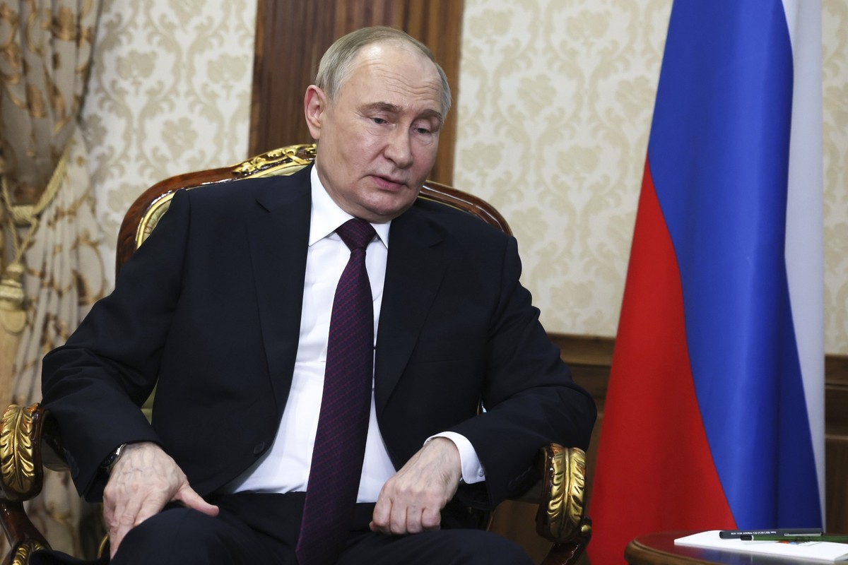 Russian President Vladimir Putin speaks to Belarusian President Alexander Lukashenko during their meeting upon his arrival at an international airport in Minsk, Belarus, Thursday, May 23, 2024. (Mikha ...
