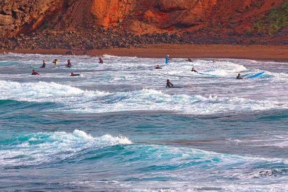 Surfers on the Atlantic Ocean in Tenerife Canary Islands Spain Model Released Property Released xkwx surfing atlantic ocean tenerife canary islands spain waves surfers beach coastline water sports sur ...