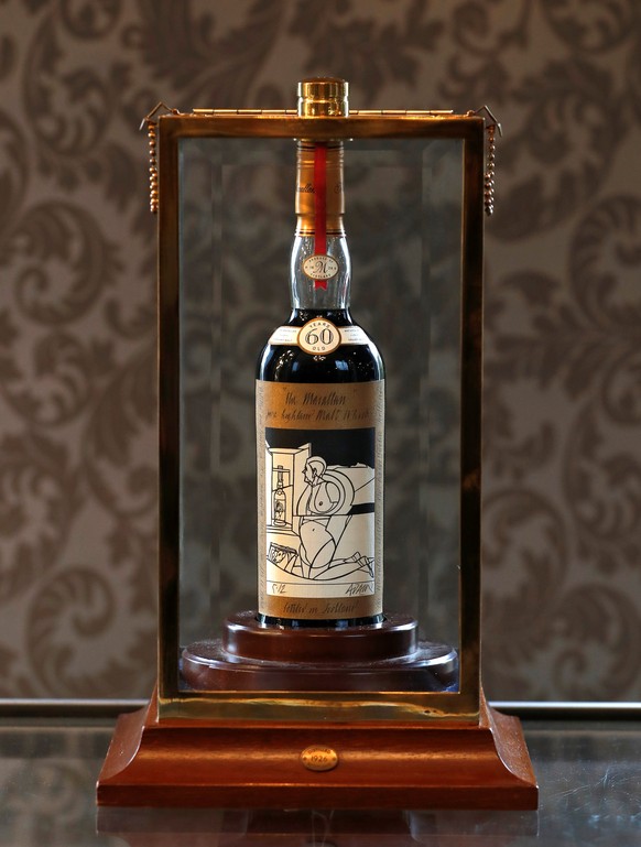 A 60-year old The Macallan Valerio Adami 1926 is seen in a glass case after it was auctioned for a record amount at Bonhams in Edinburgh, Scotland, Britain October 3, 2018. REUTERS/Russell Cheyne