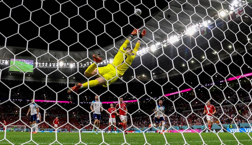 221129 -- AL RAYYAN, Nov. 29, 2022 -- Jordan Pickford Top, goalkeeper of England, makes a save during the Group B match between Wales and England at the 2022 FIFA World Cup, WM, Weltmeisterschaft, Fus ...