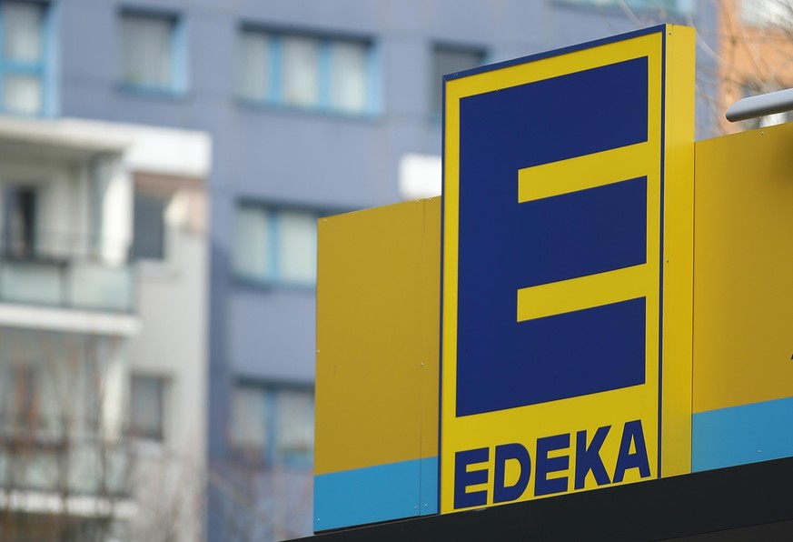 BERLIN, GERMANY - FEBRUARY 19: The logo of grocery store of German chain Edeka stands on one of its stores on February 19, 2018 in Berlin, Germany. According to media reports Agecore-Group, to which E ...