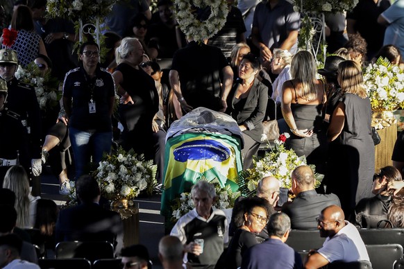 People pay their respects during during the wake for former soccer great Pele, at Vila Belmiro stadium in Santos, Brazil, Monday, Jan. 2, 2023. (AP Photo/Marcelo Chello)