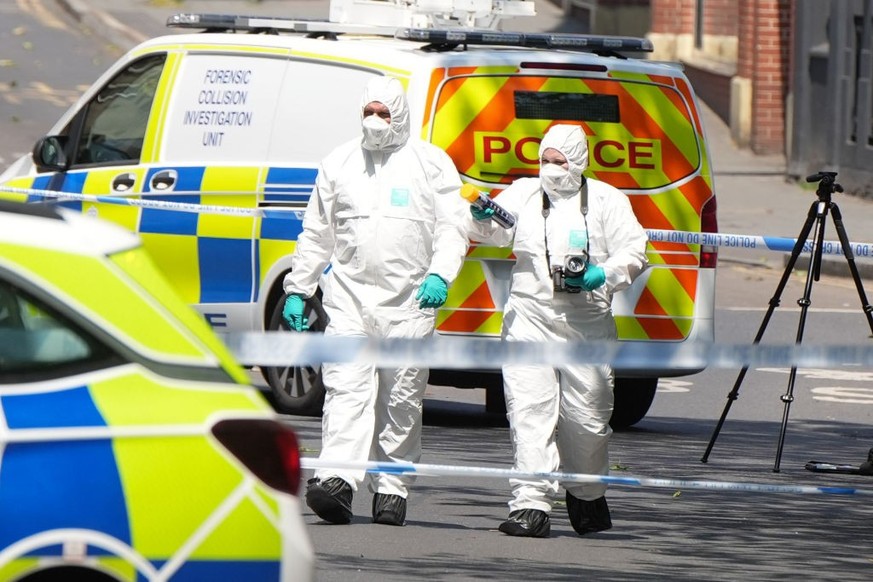 NOTTINGHAM, UNITED KINGDOM - JUNE 13: Police forensics are seen at the scene in Nottingham, United Kingdom on June 13, 2023. Three people have been found dead and a man has been arrested after police  ...