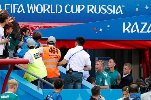 Soccer Football - World Cup - Group F - South Korea vs Germany - Kazan Arena, Kazan, Russia - June 27, 2018 Germany&#039;s Mesut Ozil clashes with fans after the match as they go out of the World Cup  ...