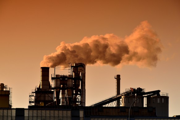 Factory with smoking chimney