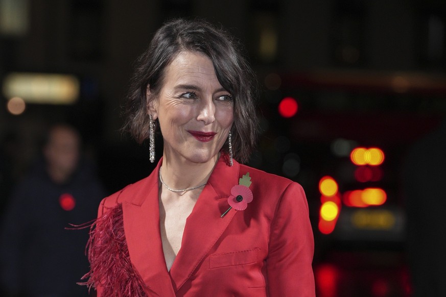 Olivia WIlliams poses for photographers upon arrival for the World premiere of season 5 of 'The Crown' in London, Tuesday, Nov. 8, 2022. (Photo by Scott Garfitt/Invision/AP)
