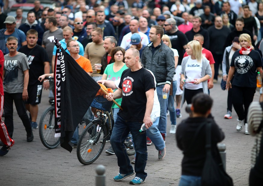 People attend a right wing protest in Koethen, Germany, September 9, 2018, after a 22-year-old German man died overnight in the eastern town of Koethen and two Afghans have been detained on suspicion  ...