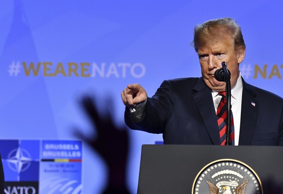 U.S. President Donald Trump points his finger during press conference after a summit of heads of state and government at NATO headquarters in Brussels, Belgium, Thursday, July 12, 2018. NATO leaders g ...