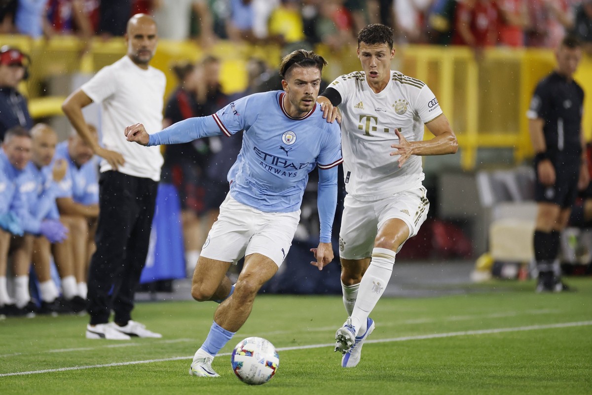 GREEN BAY, WI - JULY 23: Manchester City midfielder Jack Grealish 10 controls the ball ahead of Bayern Munich defender Benjamin Pavard 5 during a Club Friendly match on July 23, 2022 at Lambeau Field ...