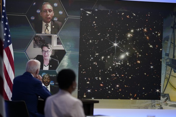 President Joe Biden listens during a briefing from NASA officials about the first images from the Webb Space Telescope, the highest-resolution images of the infrared universe ever captured, in the Sou ...