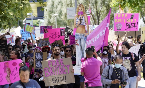 EDS NOTE: OBSCENITY - Britney Spears supporters march outside a court hearing concerning the pop singer's conservatorship at the Stanley Mosk Courthouse, Wednesday, June 23, 2021, in Los Angeles. (AP  ...