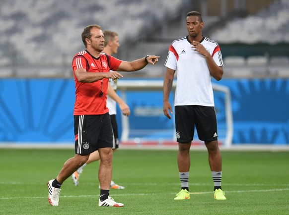 Assistant coach Hansi Flick and Jerome Boateng (R) seen during the German national soccer team training session at the Estadio Mineirao in Belo Horizonte, Brazil, 07 July 2014. Germany will face Brazi ...