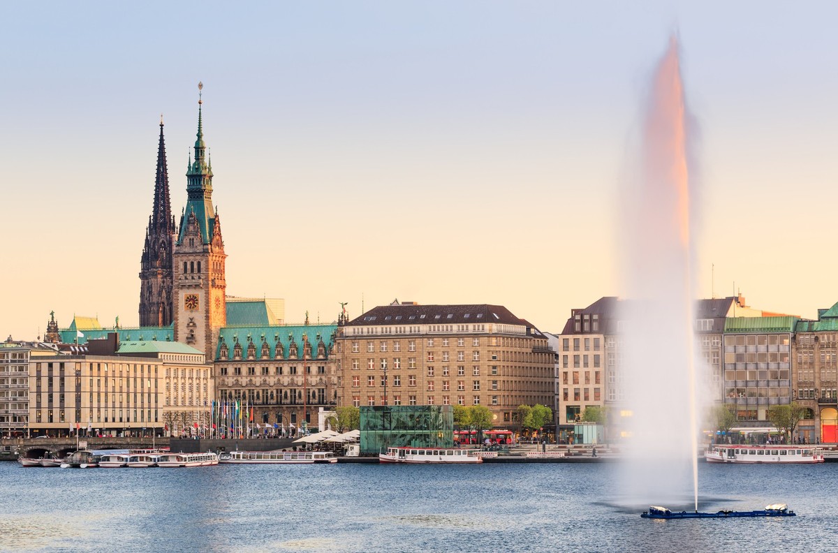 The Lake Binnenalster in Hamburg in Germany during spring time. In the toreground the famous Alter Lake fountain.