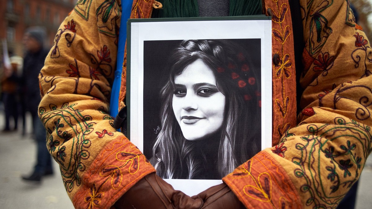 Protest For The Death Of Mahsa Amini And In Support Of Protesters In Iran A protester keeps a drawing of Mahsa Amini. Iranians of Toulouse organized a protest in Toulouse in solidarity with women and  ...