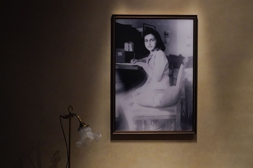 A portrait of Anne Frank is part of a replica of the home in Amsterdam where she hid, as part of the new pavilion opening at the National World War II Museum in New Orleans, Tuesday, Oct. 31, 2023. Th ...