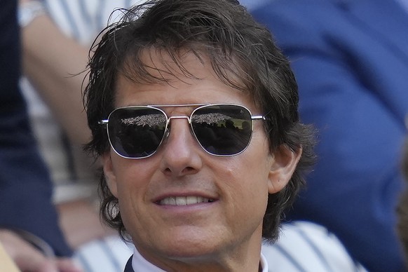 Centre Court is reflected in the sunglasses of film star Tom Cruise as he sits in the Royal Box for the final of the women&#039;s singles between Tunisia&#039;s Ons Jabeur and Kazakhstan&#039;s Elena  ...