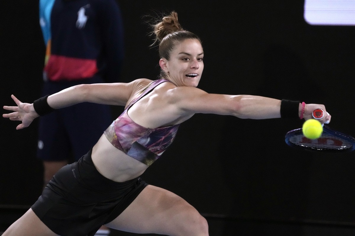 Maria Sakkari of Greece plays a backhand return to Diana Shnaider of Russia during their second round match at the Australian Open tennis championship in Melbourne, Australia, Wednesday, Jan. 18, 2023 ...