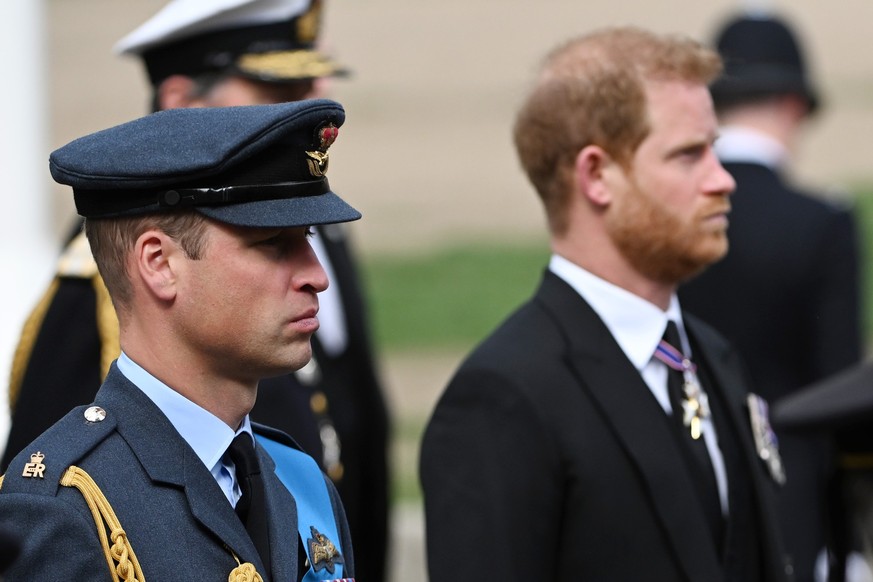 LONDON, ENGLAND - SEPTEMBER 19: Prince William, Prince of Wales and Prince Harry, Duke of Sussex follow behind The Queen&#039;s funeral cortege borne on the State Gun Carriage of the Royal Navy as it  ...