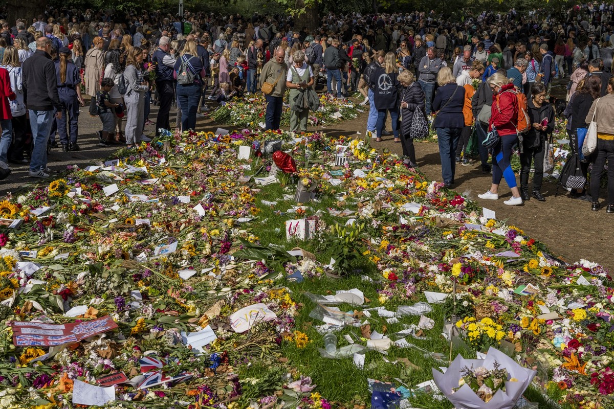 Flowers and messages placed for Queen Elizabeth II at Green Park memorial next to Buckingham Palace in London, England, Sunday, Sept. 18, 2022. The Queen will lie in state in Westminster Hall for four ...