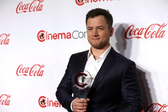 Taron Egerton, recipient of the Action Star of the Year award, poses during the CinemaCon Big Screen Achievement Awards in Las Vegas, Nevada, U.S., April 26, 2018. REUTERS/Steve Marcus