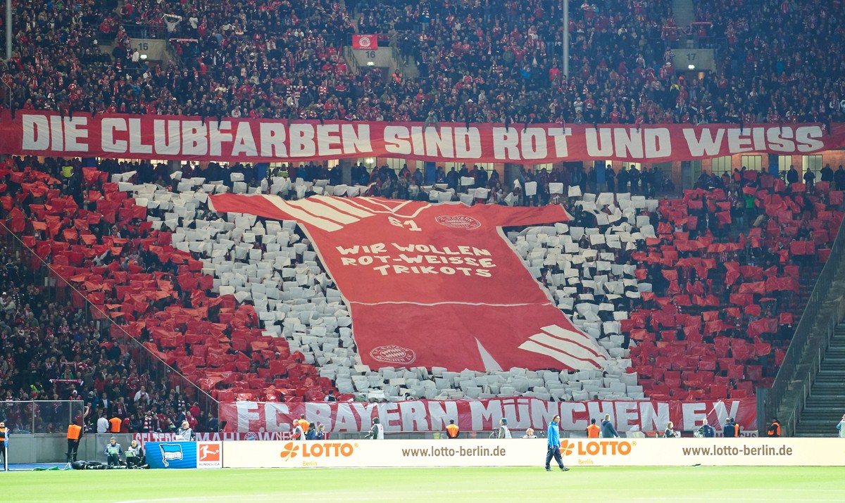 German Soccer, Berlin, September 28, 2018 fans, supporters, spectators, club flags, celebration, fan, wave, colors, sea of flags, soccerfan, clothes, drawings, masquerade, football, jacket, cowl, wais ...