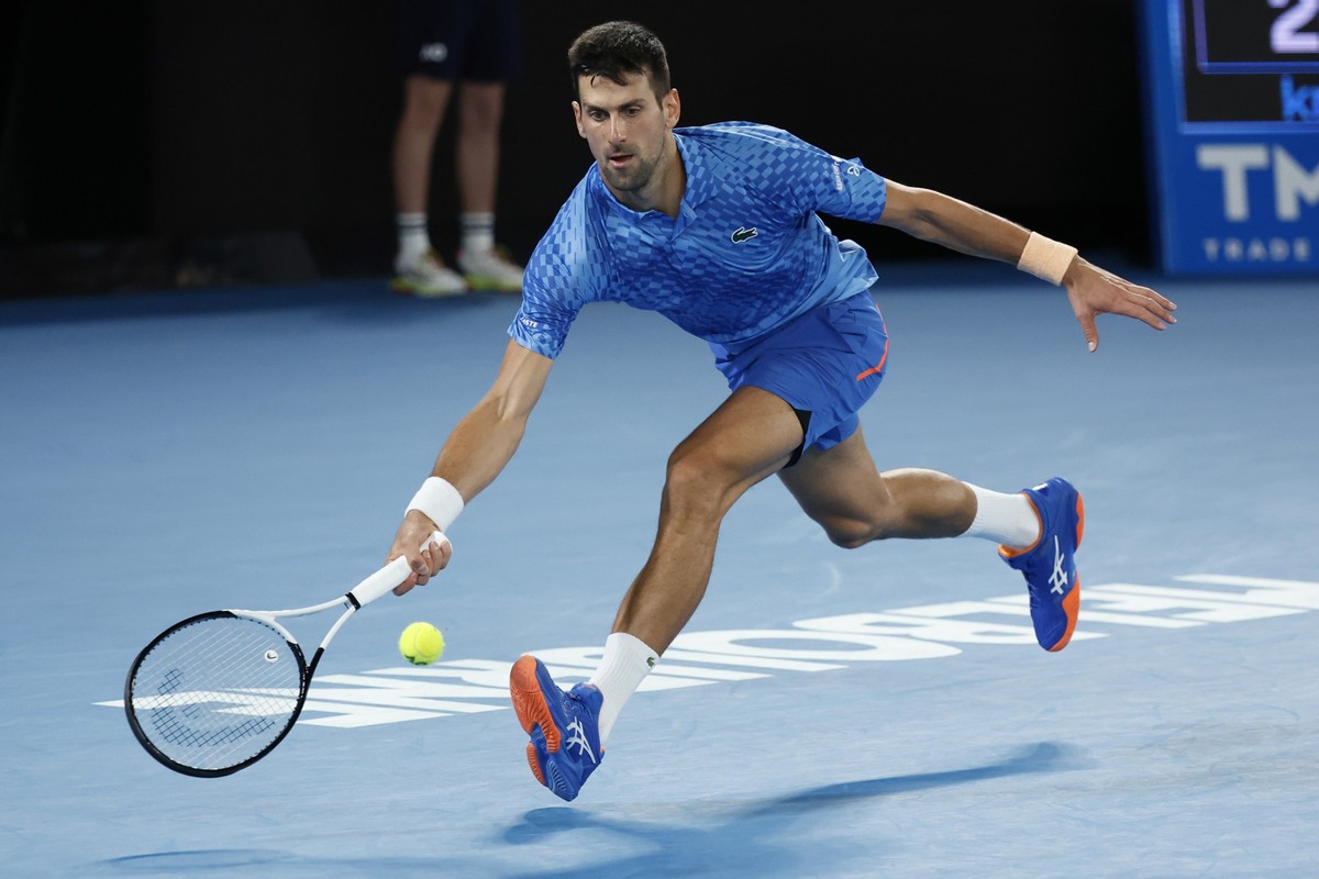 Novak Djokovic of Serbia plays a forehand to Stefanos Tsitsipas of Greece during the men's singles final at the Australian Open tennis championships in Melbourne, Australia, Sunday, Jan. 29, 2023 ...