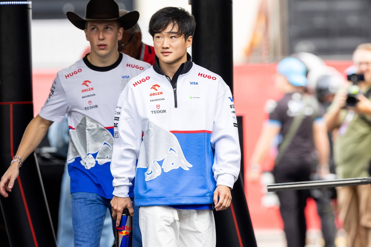 AUSTIN, TX - OCTOBER 18: Yuki Tsunoda 22 of Japan and team Visa Cash App RB F1 Team and Liamn Lawson 30 of New Zealand and team Visa Cash App RB F1 Team arrive to the paddock during the Friday session ...