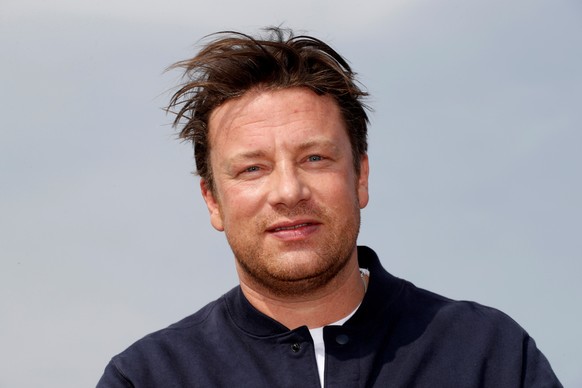 FILE PHOTO: Chef Jamie Oliver poses during a photocall at the annual MIPCOM television programme market in Cannes, France, October 15, 2018. REUTERS/Eric Gaillard/File Photo