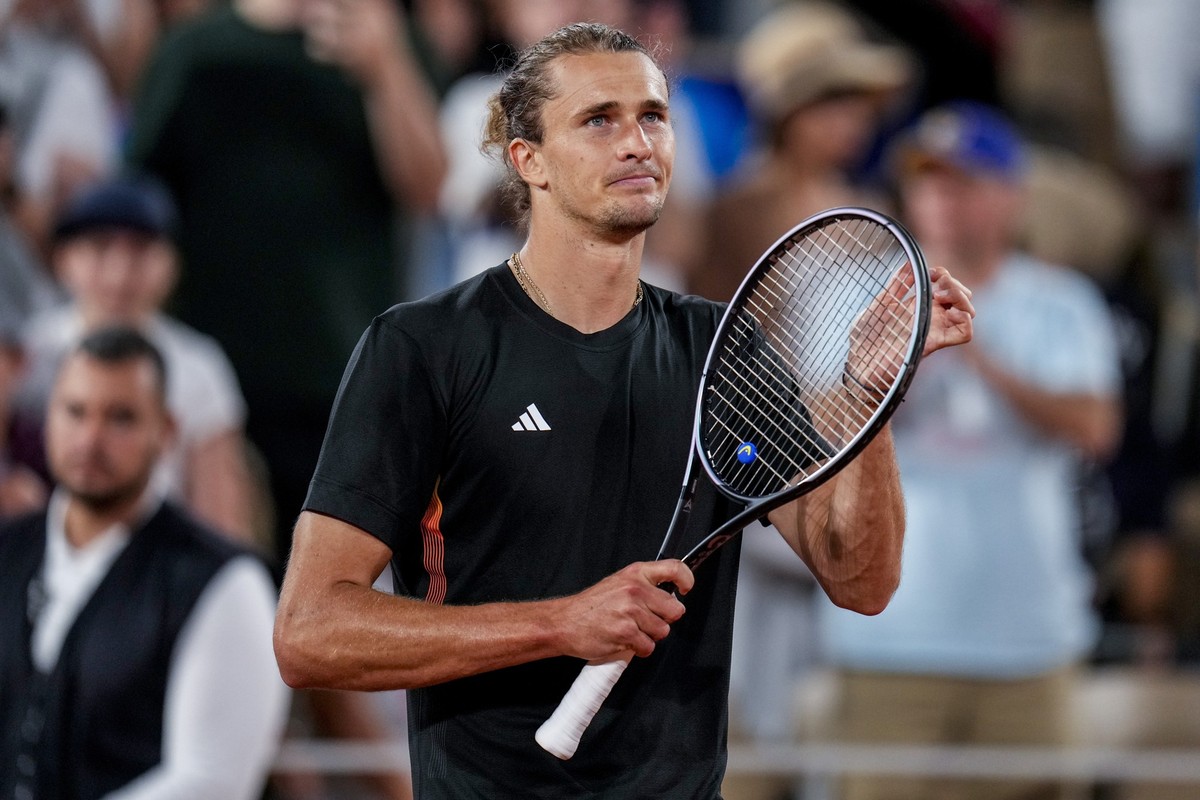 Alexander Zverev of Germany celebrates his victory over Jaume Munar of Spain during the men's singles tennis competition, at the 2024 Summer Olympics, Sunday, July 28, 2024, in Paris, France. (AP ...