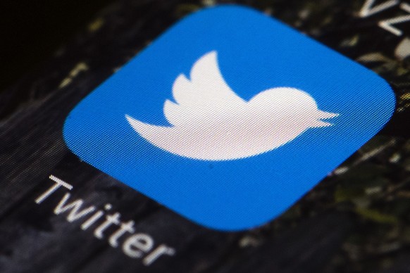 FILE- The Twitter icon is displayed on a mobile phone in Philadelphia on April 26, 2017. Twitter users were greeted early Saturday, Feb. 18, 2023 with an ultimatum from the social media app: Subscribe ...