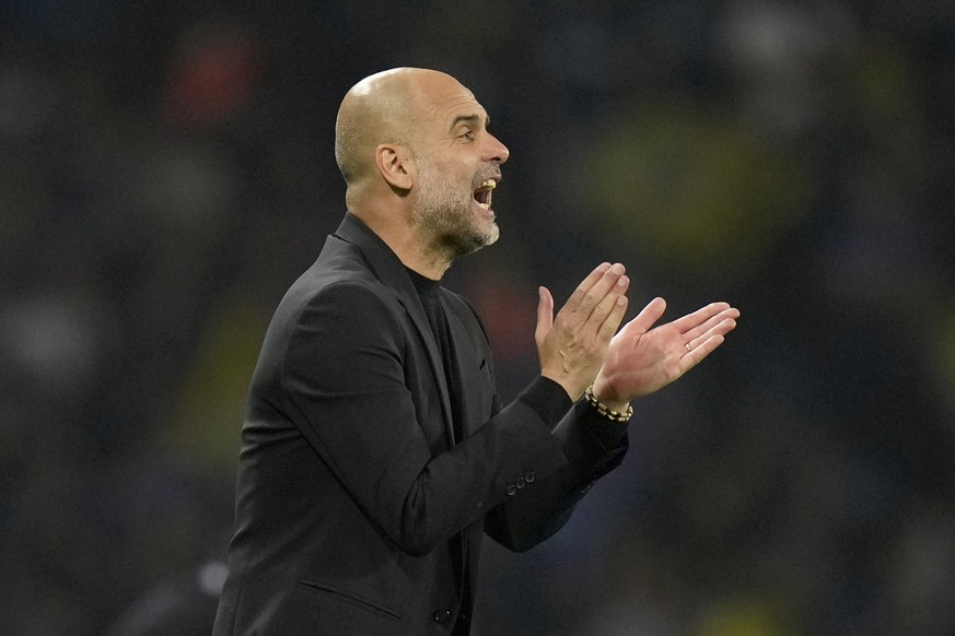 Manchester City&#039;s head coach Pep Guardiola claps his hands during the Champions League final soccer match between Manchester City and Inter Milan at the Ataturk Olympic Stadium in Istanbul, Turke ...