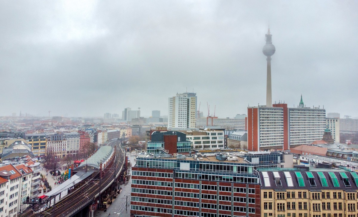 Aerial view on Hackescher Markt station or Alexander Platz station in downtown of Berlin capital -foggy weather in German capital, crane machinery in distance and Fernsehturm