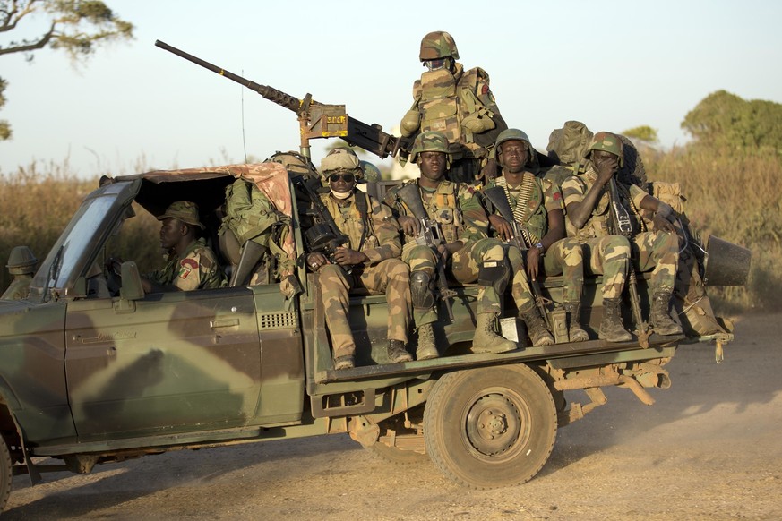 FILE - ECOWAS Senegalese troops hold their position in Barra, across from the Gambian capital Banjul Jan. 22, 2017. West Africa&#039;s regional bloc known as ECOWAS has threatened the use of force in  ...