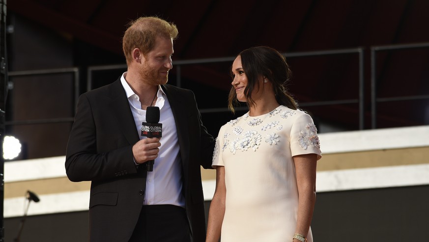 Prince Harry, the Duke of Sussex, left, and Meghan, the Duchess of Sussex speak at Global Citizen Live in Central Park on Saturday, Sept. 25, 2021, in New York. (Photo by Evan Agostini/Invision/AP)