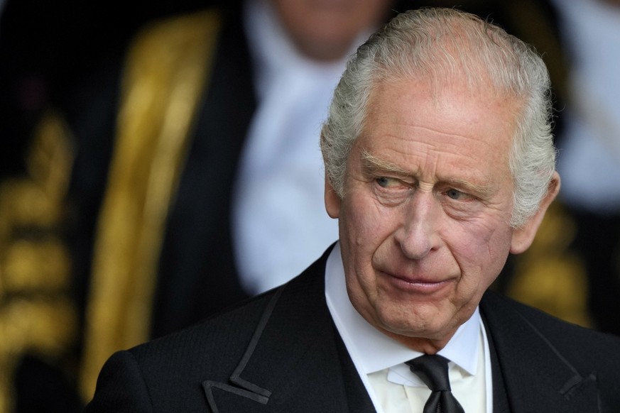 FILE - King Charles III leaves Westminster Hall, in the Palace of Westminster, where the House of Commons and the House of Lords met to express their condolences in London, Monday, Sept. 12, 2022. Kin ...