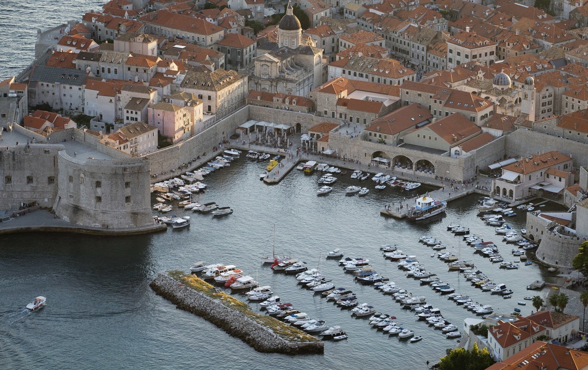 FILE -This Sept. 4, 2018 photo shows the harbor in the old town of Dubrovnik from a hill above the city. (AP Photo/Darko Bandic, File)
