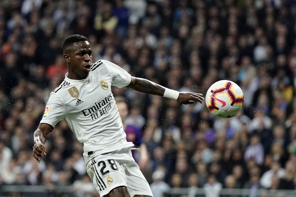Real forward Vinicius Junior goes to the ball during the Spanish La Liga soccer match between Real Madrid and FC Barcelona at the Bernabeu stadium in Madrid, Saturday, March 2, 2019. (AP Photo/Andrea  ...